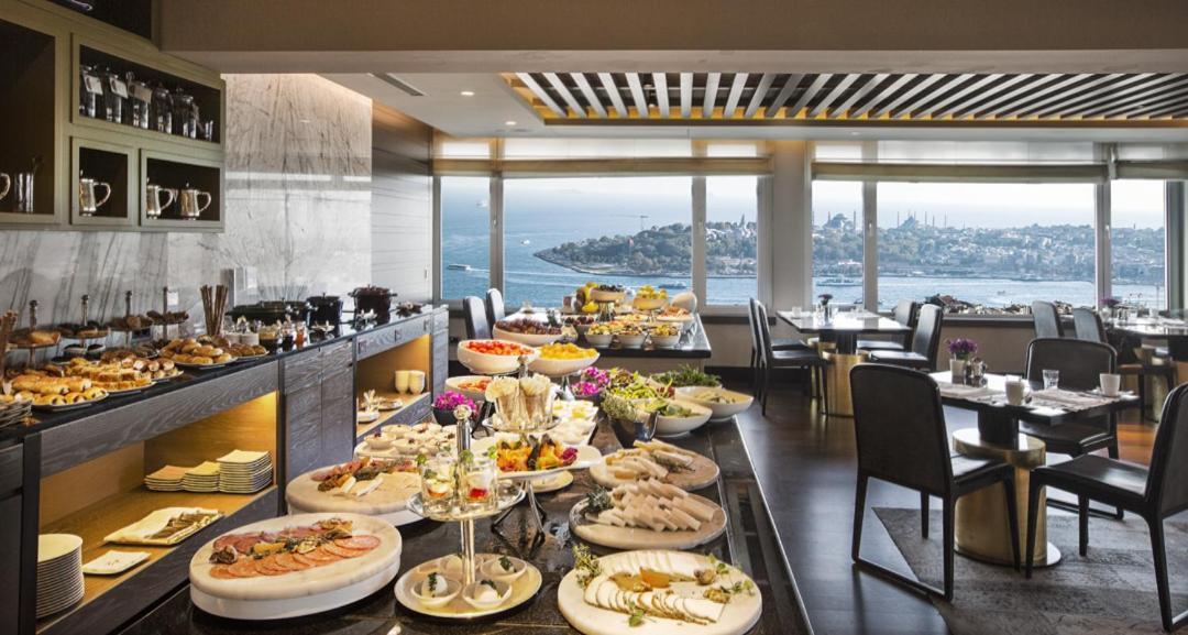 The Marmara Taksim Hotel Isztambul Kültér fotó The buffet at the lounge